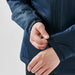Women's Pacifica Thermal Jacket - A navy thermal jacket featuring elastic cuffs, with a person's hand adjusting the sleeve. The jacket has a logo.