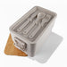 Bamboo Stack & Go Lunch Box - A rectangular bamboo stackable lunch box in light grey, featuring a bamboo lid and cutlery set inside.