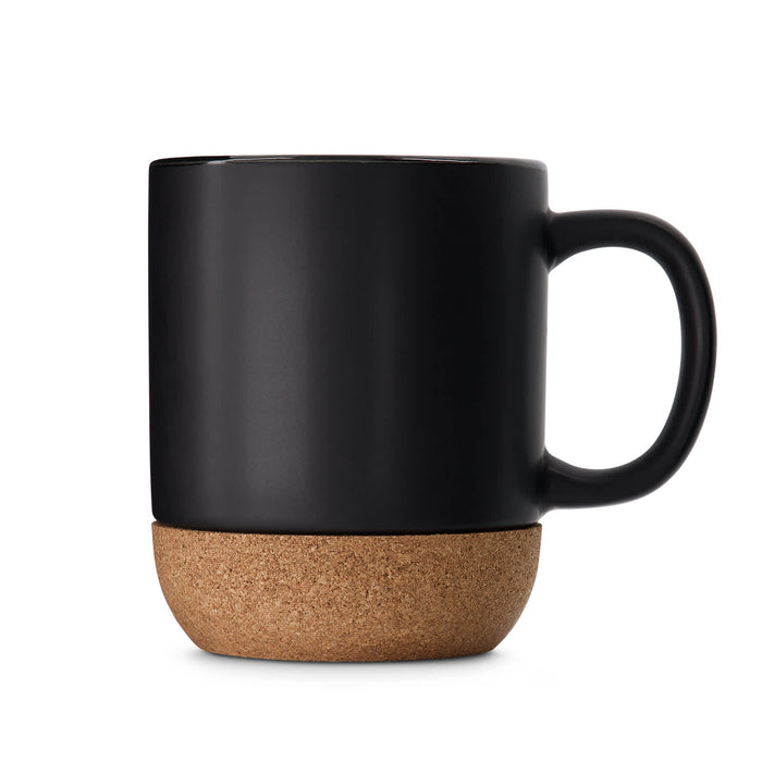 The Brew Ritual - A ceramic mug with a matte black finish and a cork base. It features a single handle and branding.