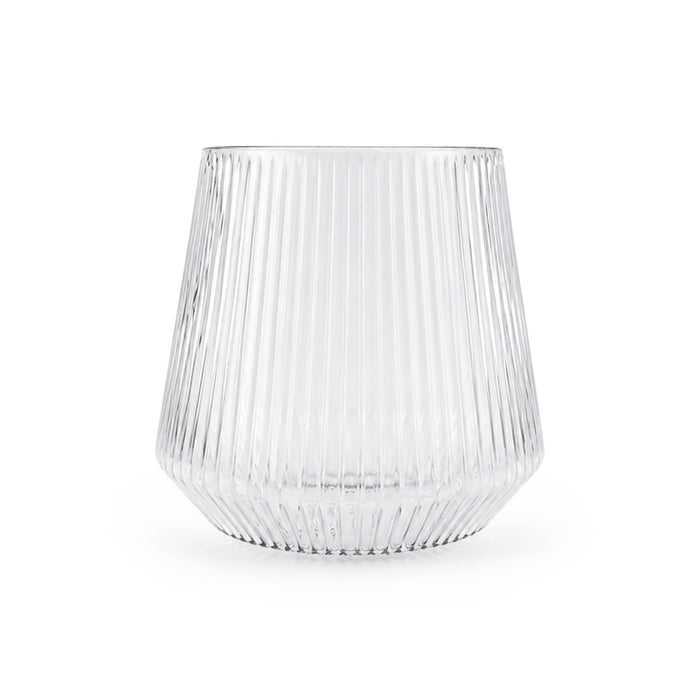 Velora Tumbler by The Line Edit. - A clear, ribbed glass tumbler with a wide base and flared shape. It features a subtle logo on the surface.