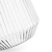 Velora Tumbler by The Line Edit. - A clear glass tumbler with a ribbed design, featuring a tapered base and a smooth rim.