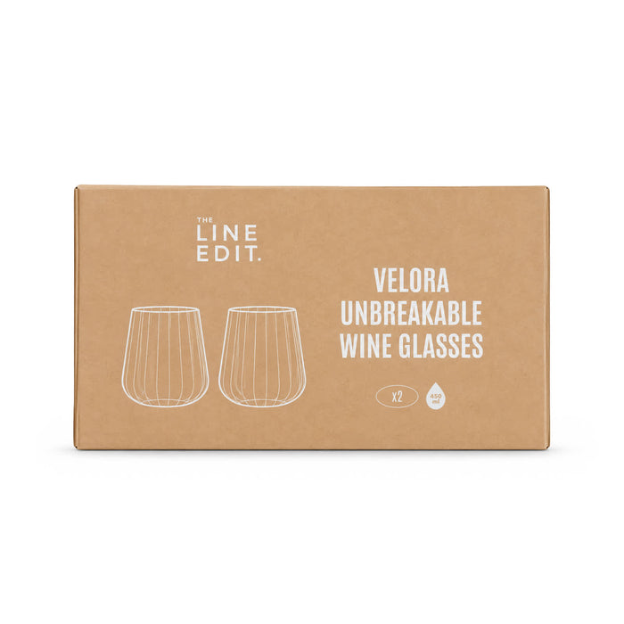 Velora Tumbler Gift Set by The Line Edit. - A gift set box containing two clear unbreakable wine glasses with a simple design, featuring a logo.