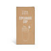 Esplanade Coffee Cup by The Line Edit. - A coffee cup packaging in cream with a lid, featuring a simple logo and a water droplet design.