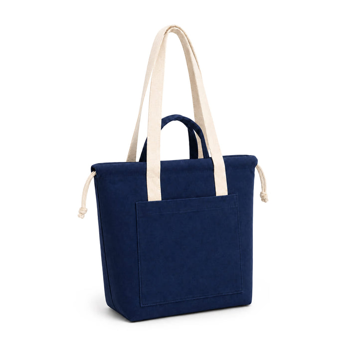 Darby Tote Bag - A navy tote bag with cream handles and a front pocket, featuring a logo on the side.