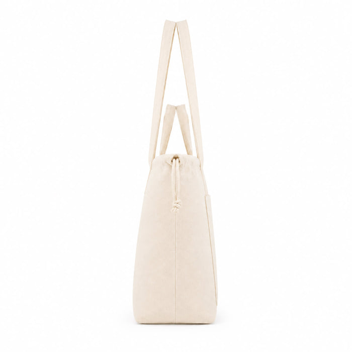 Darby Tote Bag - A beige tote bag with a drawstring closure and long, flat handles. It features a branding logo.
