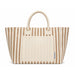 The Good Stuff Pack - A striped tote bag in beige and cream featuring two handles and a front pocket. Branding is present on the bag.