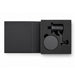 Anchor by Nomis Car Phone Holder - A black car phone holder with a mount, displayed inside a black packaging box. The product includes a holder and a base.