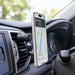 Anchor by Nomis Car Phone Holder - A car phone holder in black mounted on a dashboard air vent, displaying a smartphone with navigation.