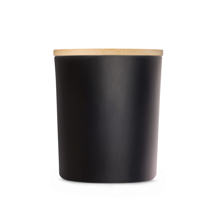 The Host Edit - A large black glass candle with a smooth finish and a bamboo lid. Minimalistic design with a sleek appearance.