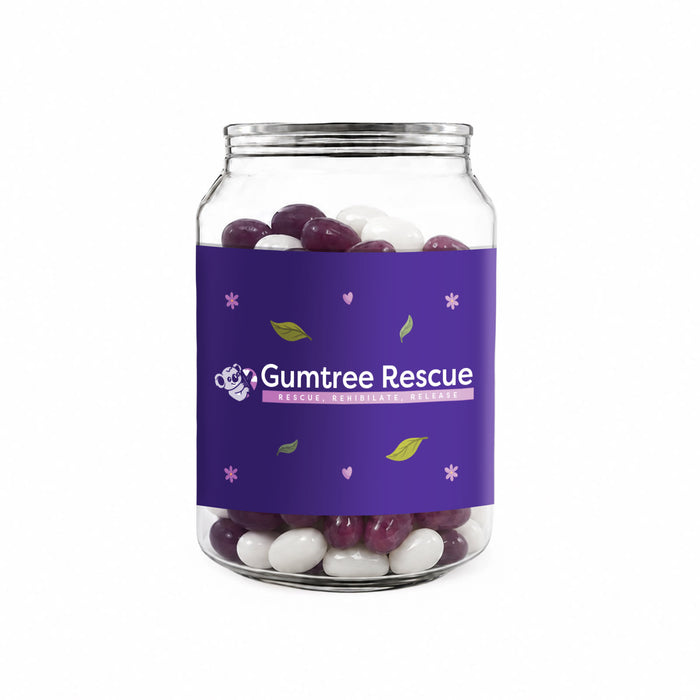 Corporate Colour Jelly Beans in Clear Can 210g - A clear canister filled with purple and white jelly beans, featuring a purple label with a logo.