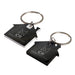 House Stainless Steel Keytag - Two house-shaped keytags in black and white, featuring a keyring and a logo on each.