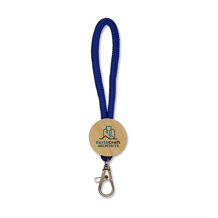 Luxeloop Keytag - A blue keytag with a wooden circular pendant featuring a logo, attached to a metal clasp.