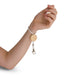 Luxeloop Keytag - A wrist keytag featuring a wooden circular base and a white elastic cord with a silver clip attachment.