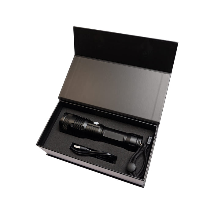 Lumi Rechargeable Torch - A rechargeable black torch displayed in a black gift box, accompanied by a charging cable and wrist strap.