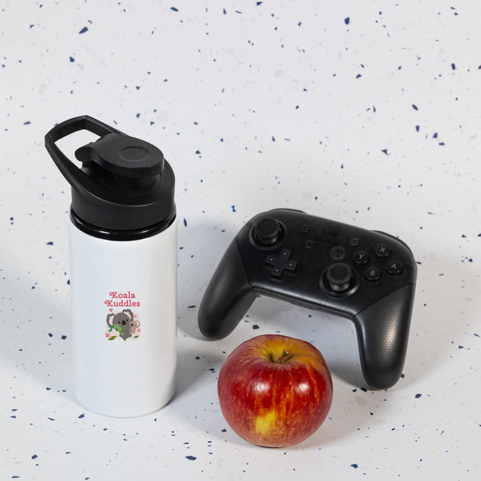 Amore 500ml Junior Bottle - Free Flow Lid - A drink bottle in white with a black lid, accompanied by a red apple and a black gaming controller.