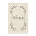 Haven Medium Cotton Tea Towel - A cream-coloured tea towel featuring a floral design with green leaves and small pink accents, with a logo at the centre.