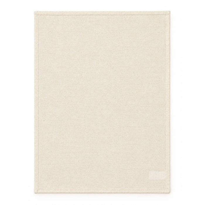 Haven Large Cotton Tea Towel - A large, cream-coloured cotton tea towel with a hemmed edge and a logo on one corner.