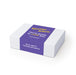 The Daily Setup - A rectangular white box with a purple label, featuring text and a logo. The box has a smooth surface.