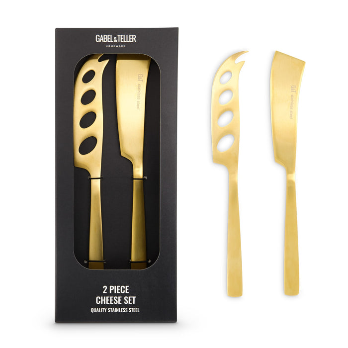 The Festive Edit Gift Set - A cheese set featuring two stainless steel knives with a gold finish, presented in a black box.