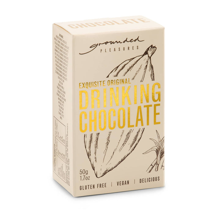 The Pause Pack - A package of drinking chocolate in cream and beige, featuring a logo and a sketch of cocoa pods.