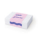 The Nibble Set - A white box with pink and blue design featuring a logo. The text includes playful phrases and a wrap-around band.