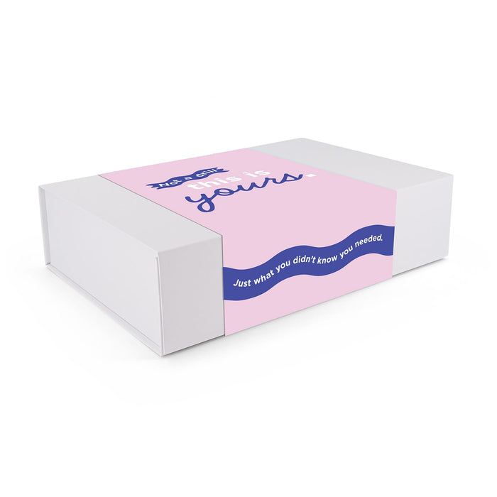 The Nibble Set - A rectangular box in white and pink with a logo and decorative text on the front.