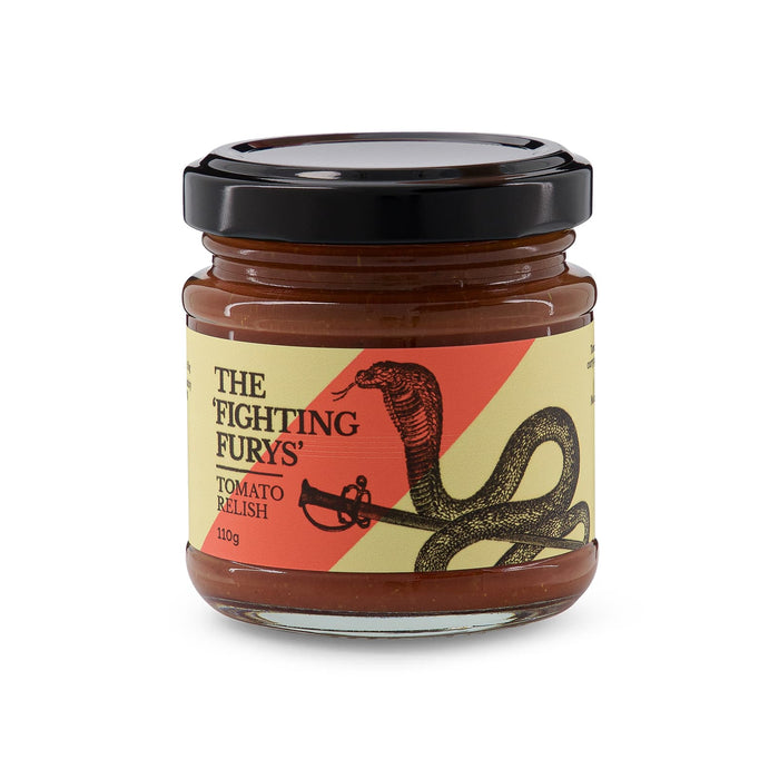 The Refined Graze - A jar of tomato relish featuring a black lid, with a design of a snake and a sword, in red and yellow tones.
