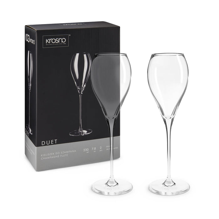 Bubbles & Beachdays - A set of two elegant champagne flutes in a sleek box, showcasing their refined shape and clear glass design.