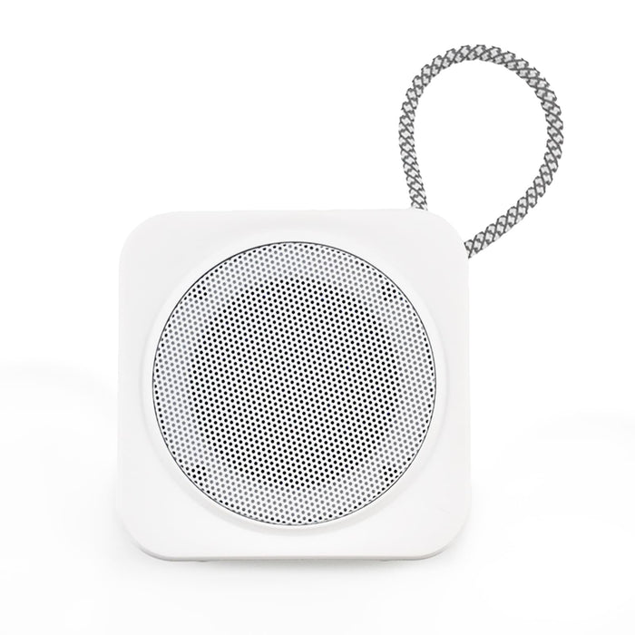 The Daily Setup - A white portable speaker with a metallic mesh grille and a wire loop for hanging.