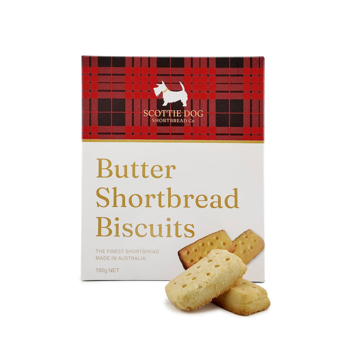The Brew & Bite - A box of Scottie Dog butter shortbread biscuits with a red tartan design. Three biscuits are displayed in front of the box.