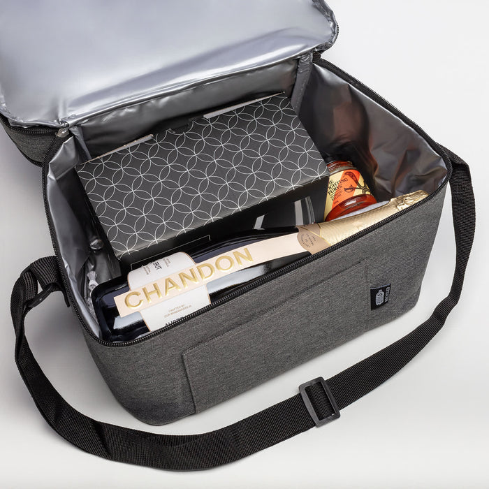 The Chandon Escape - A grey insulated bag containing a bottle of Chandon, gourmet snacks, and a gift box. Features a branded logo.