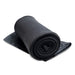 The Winter Warmer Pack - A rolled black fleece blanket with a smooth finish, featuring a protective fabric layer underneath.
