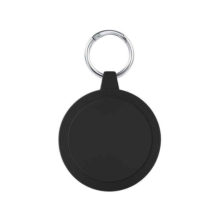 The Ultimate Welcome - Hot Chocolate Edition - A round black keychain holder features a silver keyring. The surface is smooth with subtle grooves around the edge.