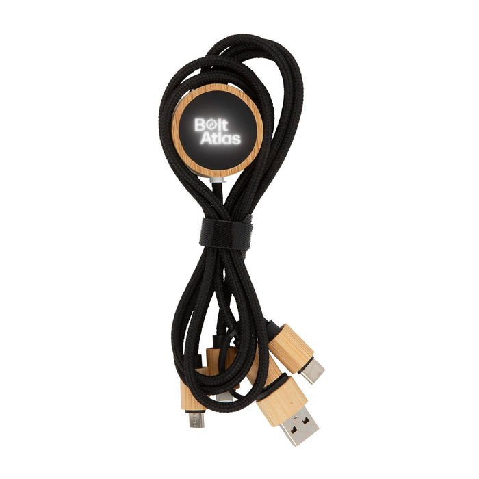 Tech Pack Power - A set of black charging cables with wooden ends, secured with a round wooden holder featuring a logo.