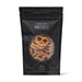 The Perfect Pairing - A black packaging bag filled with crunchy, salted pretzels. The bag features a logo and decorative design.
