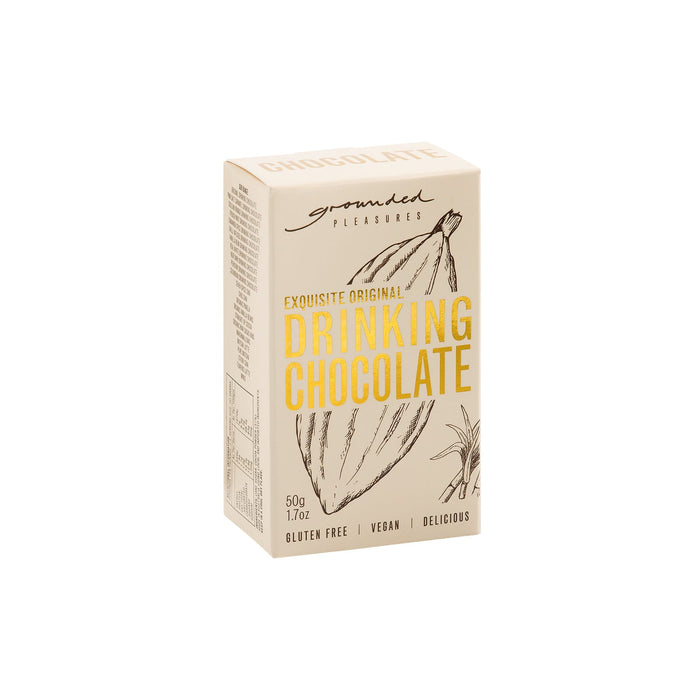 The Treat Kit - A box of drinking chocolate with a light beige background, featuring illustrations of cocoa pods. It has a logo.
