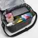 The Wine & Unwind - A drink bottle lies in a grey insulated bag, alongside assorted boxes and an additional container.