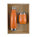 Pura Cardboard Gift Set - A drink bottle and a mug set in vibrant orange, presented in a cardboard gift box. The bottle features a stainless steel base.
