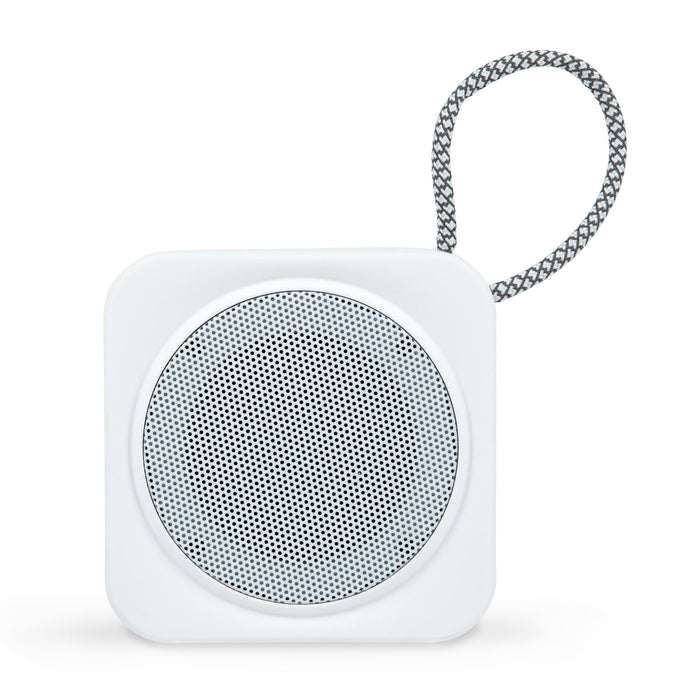 The Escape Pack - A white portable speaker with a round mesh grille and a fabric strap. The design is minimalist and compact.