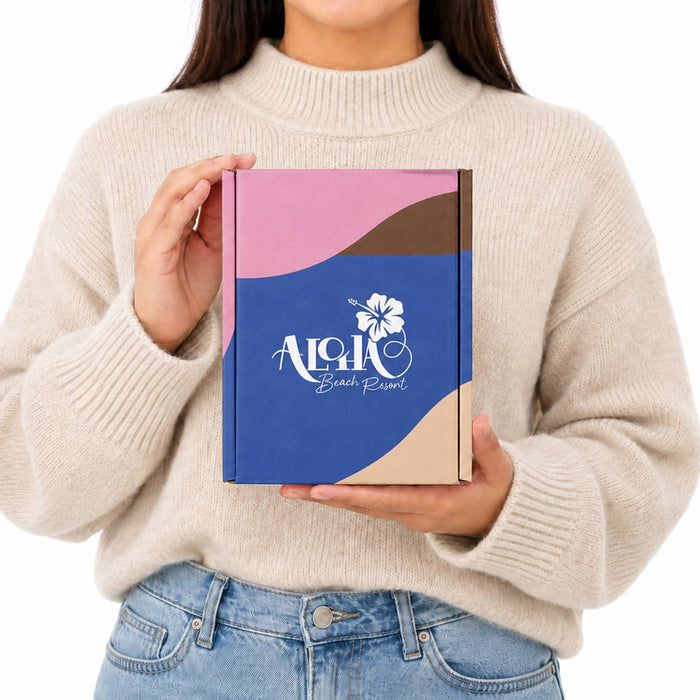 Custom Box with Locking Lid 125 x 170 x 65mm - A woman holds a custom box with a locking lid, featuring pink, blue, and brown colours and a logo on the front.