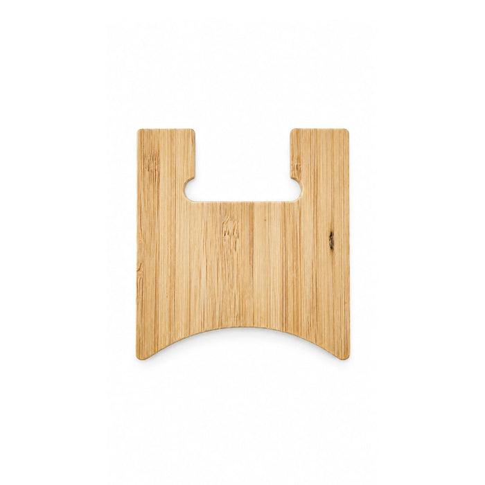 Oscar Illuminating Charging Stand - A bamboo chopping board features a unique shape with a cut-out handle. The surface showcases natural wood grain.