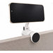 Tutor Maglock Phone Holder - A white phone holder with a black circular base and an attached smartphone, designed to clamp onto a surface.