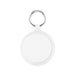 The Ultimate Welcome - Tea Edition - A keyring with a round, white attachment featuring a textured rim, ideal for holding keys or small items.