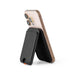Cozy Phone Wallet - A smartphone in a black Cozy Phone Wallet, showcasing a sleek design with a stand feature.
