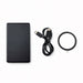 Axial by Nomis Solid State Power Bank - A black solid state power bank, a USB-C cable, and a circular accessory. The product features a logo.