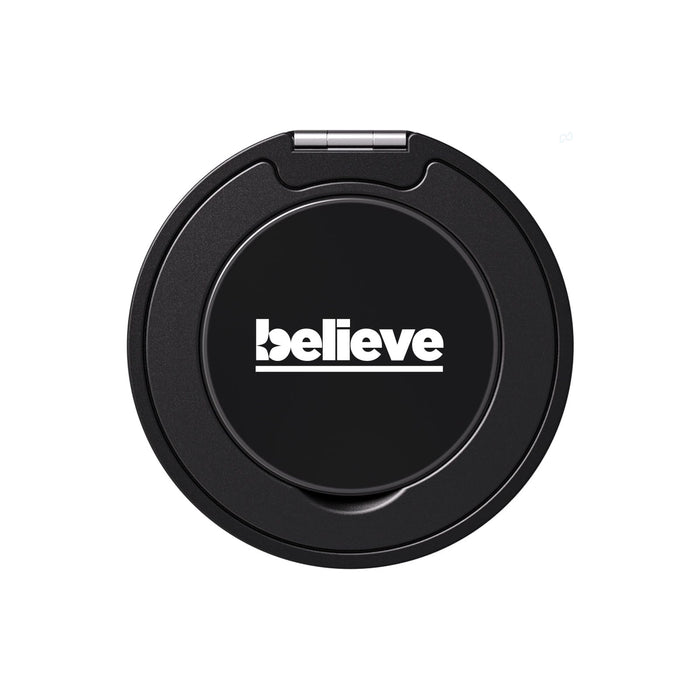 Tech Pack Essential - A black phone grip and stand with a circular design and a logo on its surface.