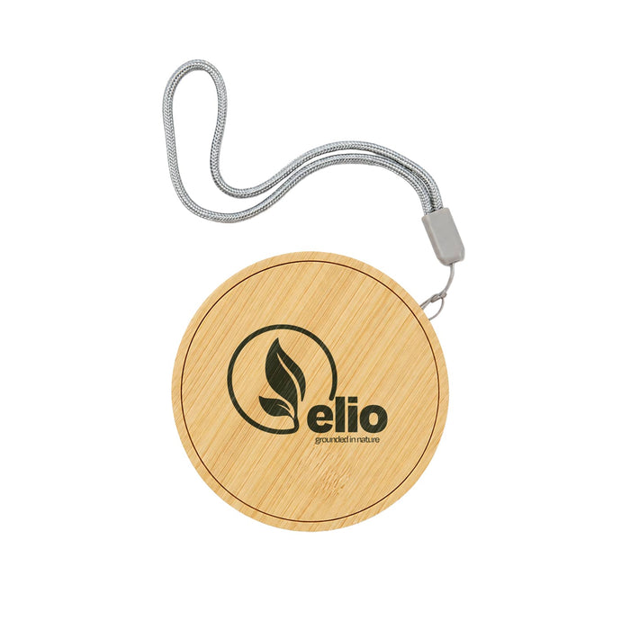 Reveal Circle Wireless Charger Set - A round bamboo wireless charger with a grey strap and an embossed logo.