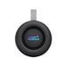 Delta 8W Speaker - A round black speaker with a grey strap, featuring a logo in vibrant colours.