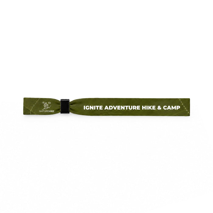 Event Wrist Band - A green wristband with a logo and text detailing an adventure hiking and camping theme.