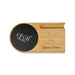 Cup Warmer with Inductive Charger - A bamboo cup warmer with a black induction charging pad, featuring branding on the surface.
